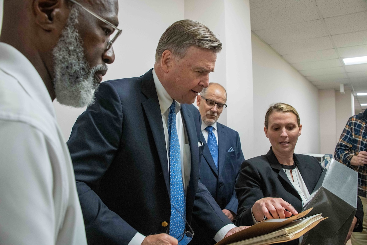 Air Force Historical Research Agency leadership and staff orient Ambassador (retired) W. Stuart Symington, second from left, with records collections housed in the AFHRA archives at Maxwell Air Force Base, Ala