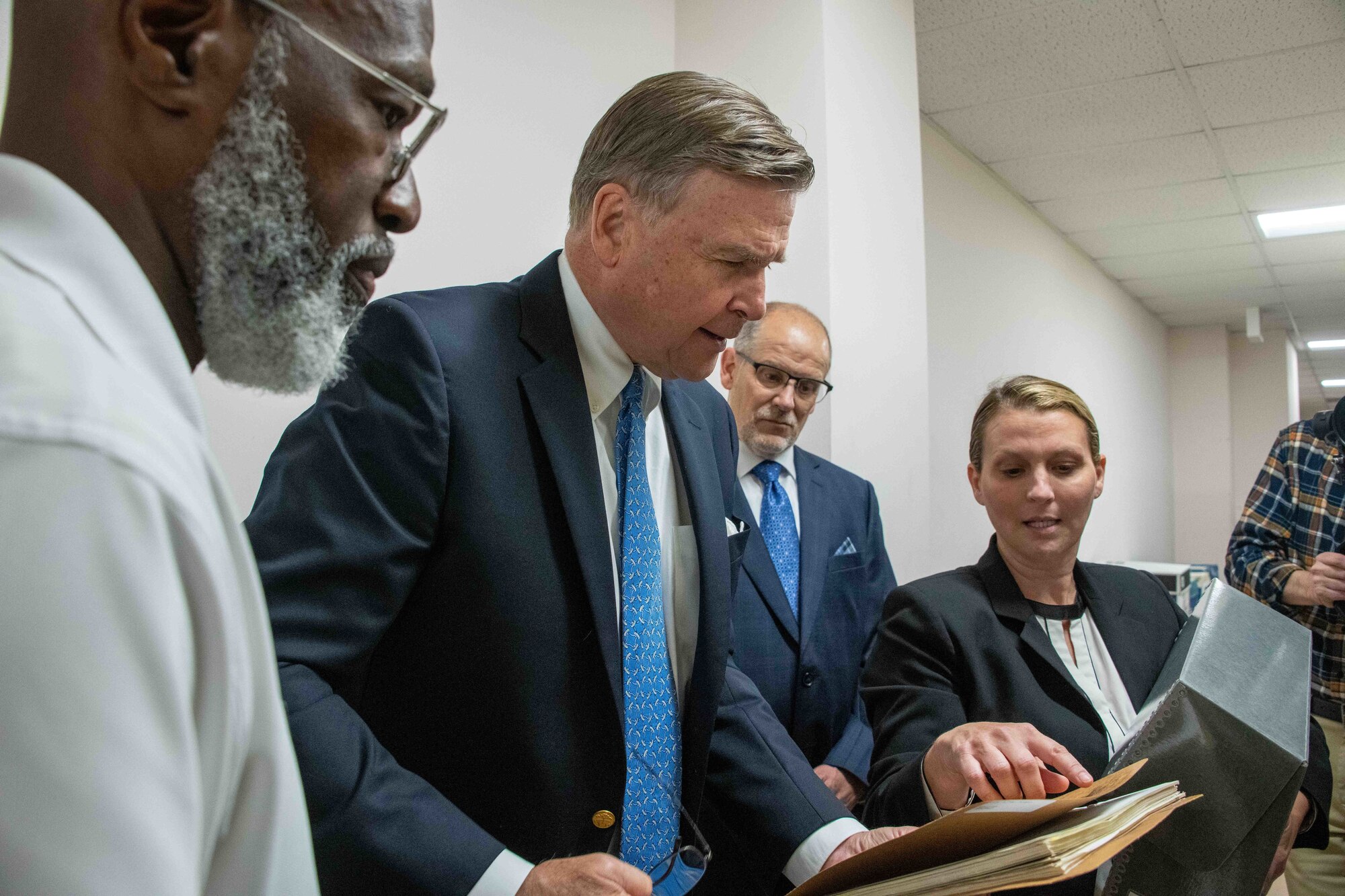 Air Force Historical Research Agency leadership and staff orient Ambassador (retired) W. Stuart Symington, second from left, with records collections housed in the AFHRA archives at Maxwell Air Force Base, Ala