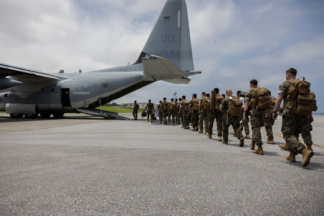 U.S. Marines with III Marine Expeditionary Force (MEF) board a KC-130J Super Hercules assigned to Marine Aerial Refueler Transport Squadron (VMGR) 152 during an Alert Contingency Marine Air-Ground Task Force Exercise (ACMEX) at Kadena Air Base, Okinawa, Japan, May 19, 2023. ACMEX confirms the III MEF Marines' crisis response capability as part of a Stand-in-Force within the First Island Chain. (U.S. Marine Corps photo by Lance Cpl. Sav Ford)