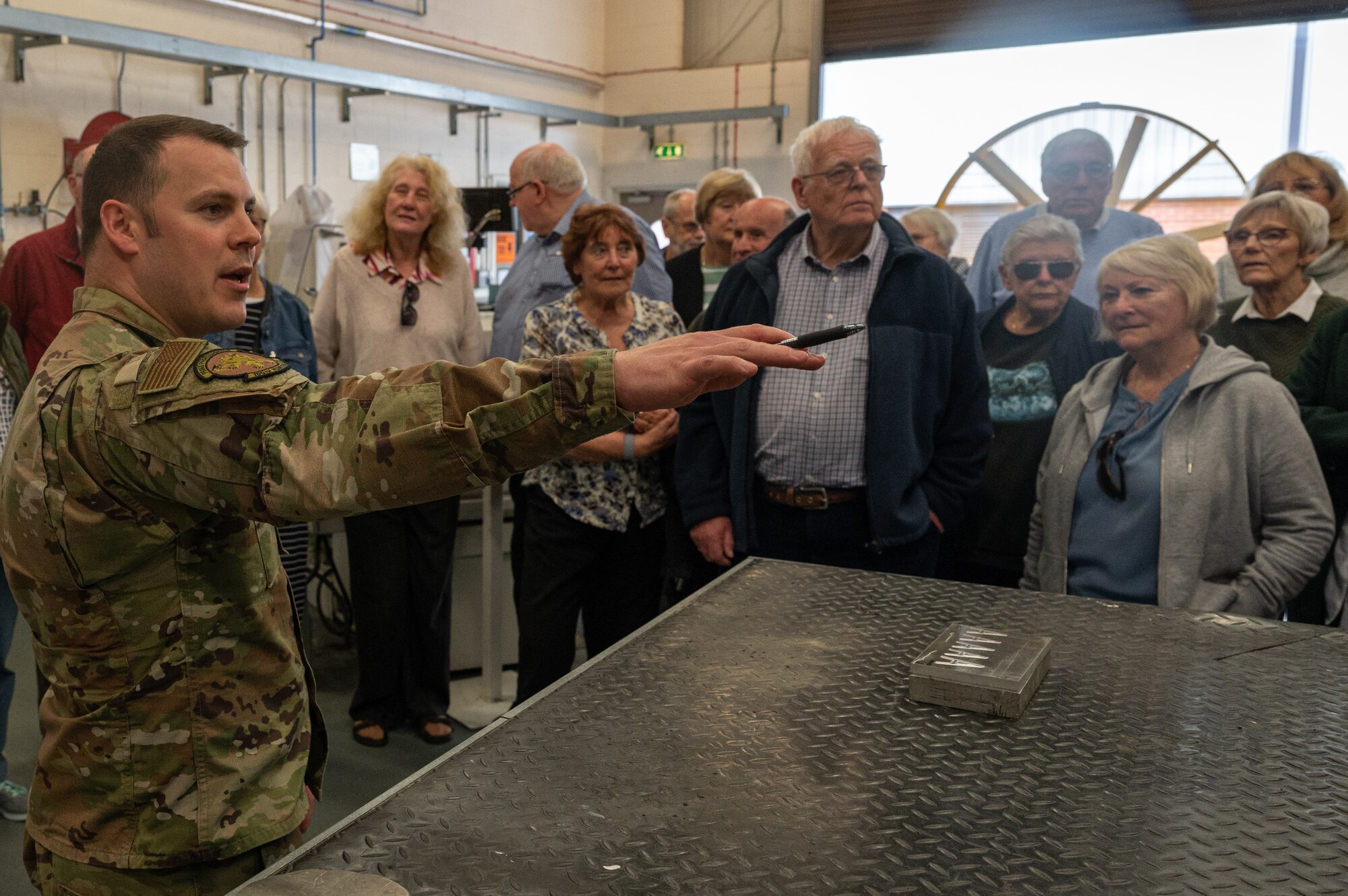 U.S. Air Force Tech. Sgt. Logan Portell, 100th Maintenance Squadron aircraft metals section chief, demonstrates how replacement KC-135 Stratotanker aircraft parts are made during a base tour at Royal Air Force Mildenhall, England, May 16, 2023.