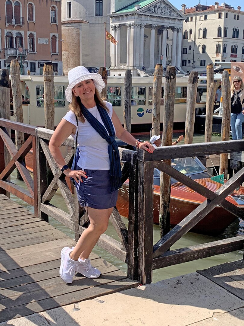A woman poses in Venice.