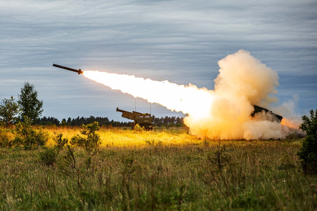 Soldiers engage targets with a pair of high mobility artillery rockets.