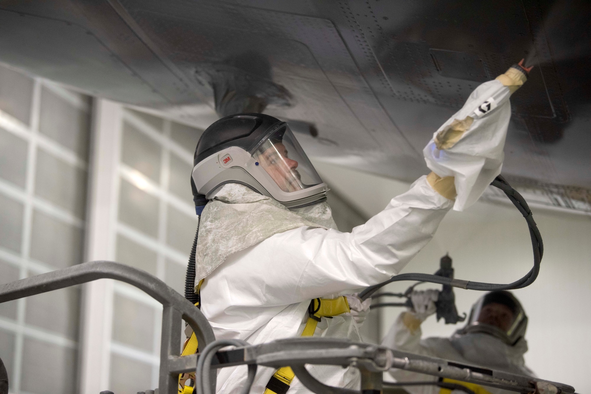 Painter painting aircraft