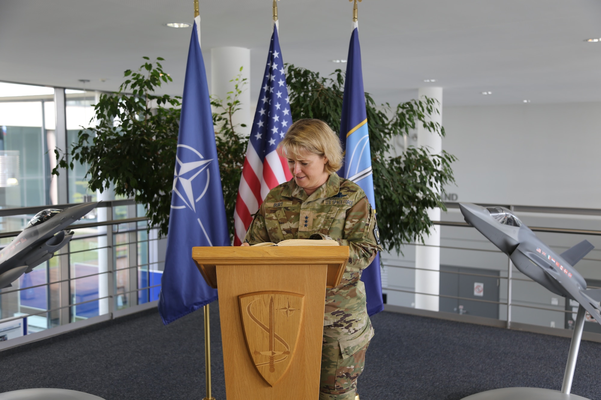 Lt Gen. DeAnna Burt, Chief Operations Officer for the United States Space Force, signs guest book at NATO Allied Air Command at Ramstein Air Base, Germany, May 22, 2023.
Burt visited the NATO Space Center within NATO Allied Air Command to learn and understand how the U.S. can best integrate and support the Alliance’s space mission.
In December 2019, NATO Heads of State and Government declared space as the Alliance's "fifth domain" of operations, alongside land, sea, air and cyberspace, which provides new space for information sharing, capability building, and multilateral cooperation alongside our NATO Allies and Partners.