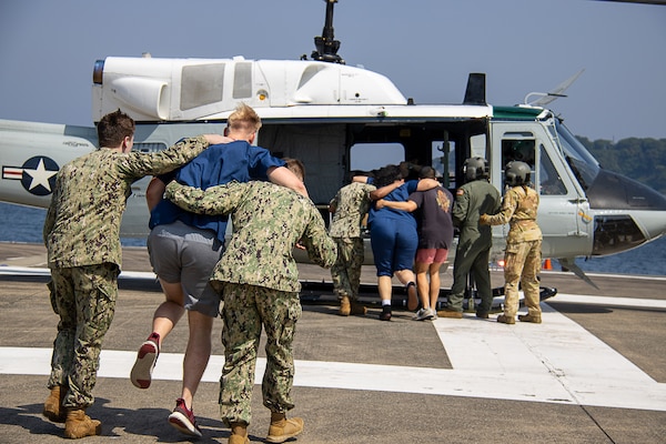USNMRTC Sailors and 459th Airlift Squadron pilots help to evacuate simulated patients from Yokosuka Naval Base at a large-scale, multi-day, joint-partner exercise to promote interoperability and readiness at USNH Yokosuka