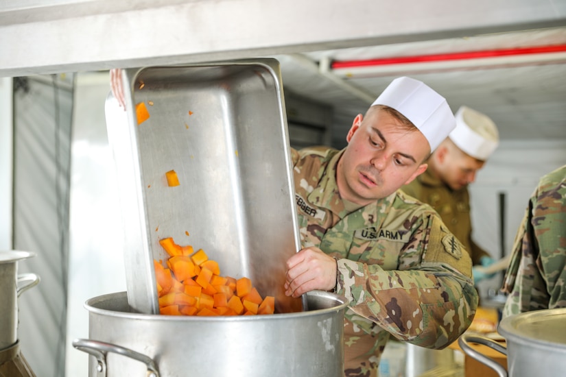 Spc. Justin Webber, a food service specialist assigned to the 19th Special Forces Group Support Battalion, prepares a soup during the “Final Four” of the Philip A. Connelly Competition at Camp Williams, Utah, February 25, 2023. Webber was one of several 19th Soldiers who supported the 1457th Forward Support Company, 1457th Engineer Battalion, Utah National Guard. (US Army photo by Sgt. 1st Class Rich Stowell)