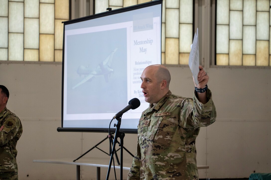 Air National Guard Senior Master Sgt. Justin E. Greenhow, who serves as the 111th Attack Wing Headquarters first sergeant, addresses the junior enlisted members of the Wing during the Mentorship May event hosted at Biddle Air National Guard Base in Horsham, Pennsylvania, May 7, 2023. The purpose of the event was to serve as a launch point for a more formal mentoring program at the Wing, and focused on "Resolve, Resiliency, Relationships and Readiness." The event was held in a round-robin fashion at four different locations for the command’s Rising Six (junior enlisted), the Top Three (senior enlisted), Company Grade Officers and Field Grade Officers. (U.S. Air National Guard courtesy photo by Matthew Bergh)