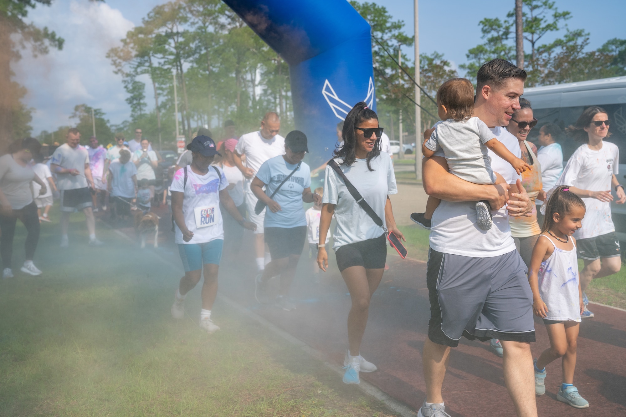 Airmen from the 81st Training Wing and families participate in the Armed Forces Day Color Run at Keesler Air Force Base, Mississippi, May 20, 2023.