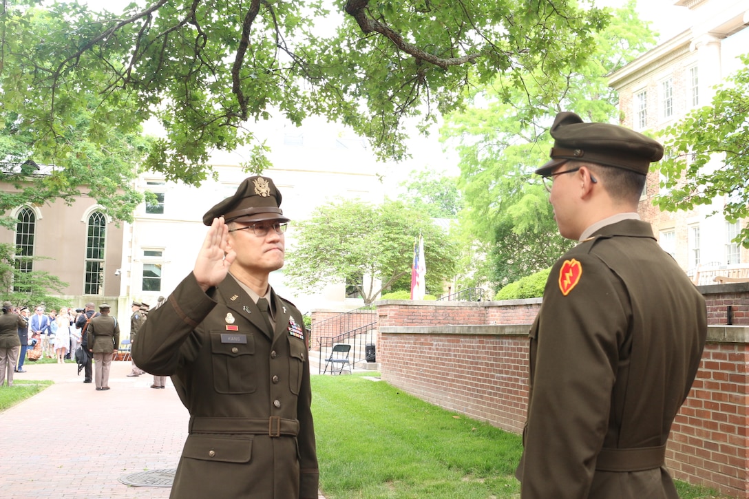 Chaplain administers oath to son during ROTC commissioning ceremony at UNC