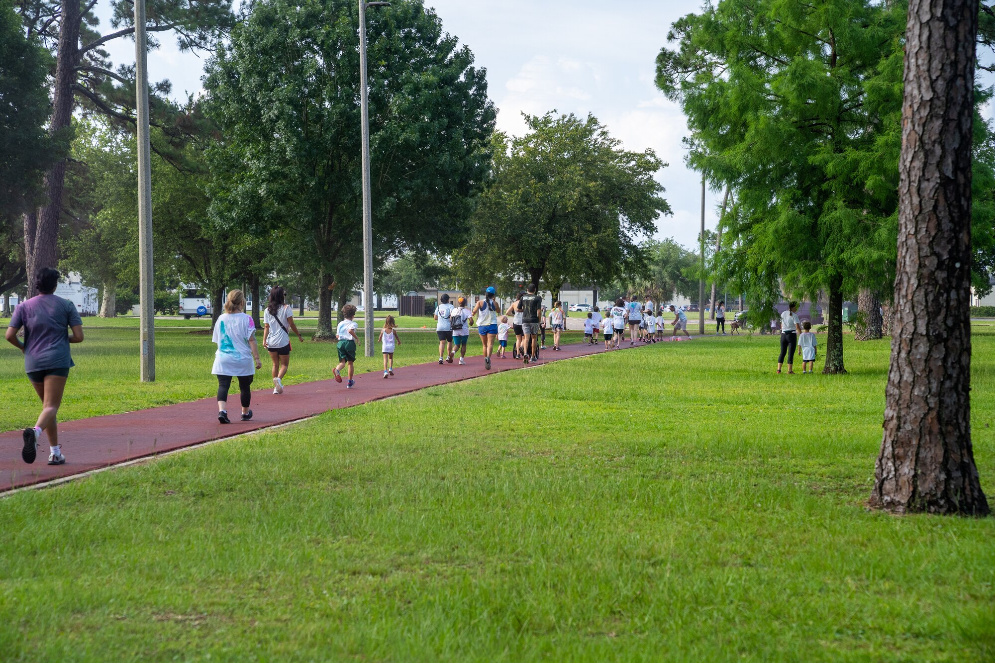 Airmen from the 81st Training Wing and families participate in the Armed Forces Day Color Run at Keesler Air Force Base, Mississippi, May 20, 2023.