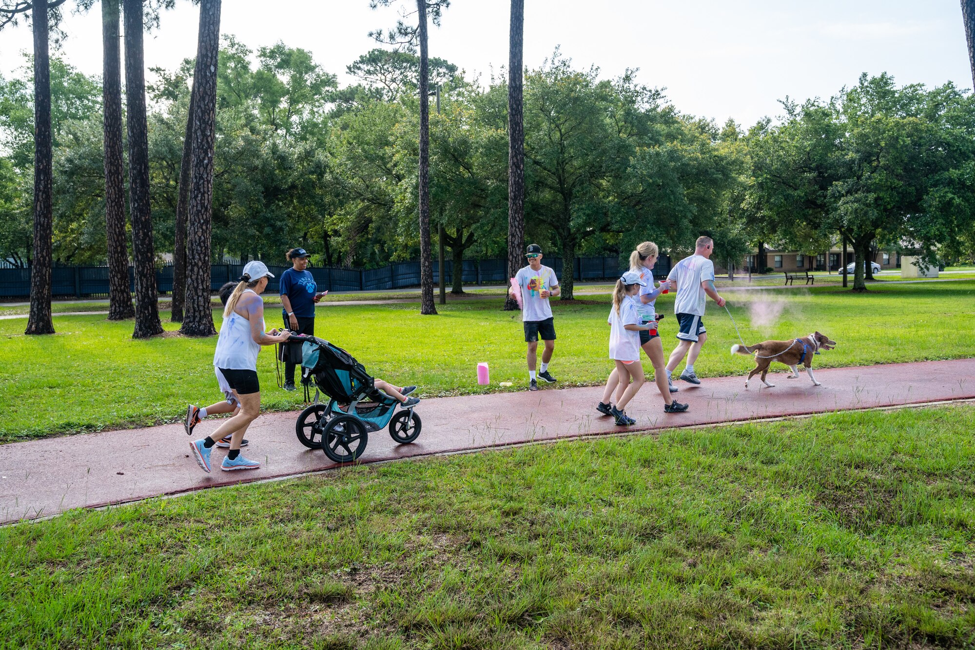 Airmen from the 81st Training Wing and families participate in the Armed Forces Day Color Run at Keesler Air Force Base, Mississippi, May 20, 2023.