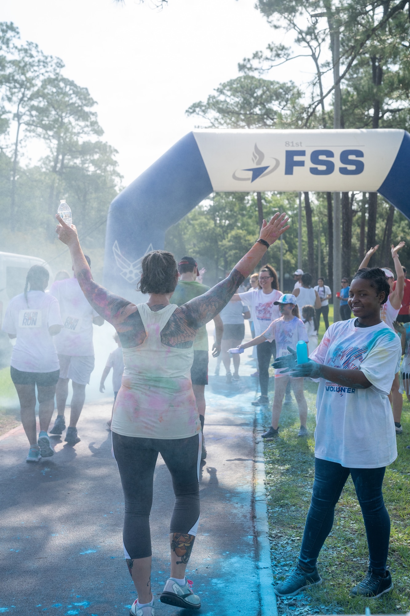 Airmen from the 81st Training Wing and families participate in the Armed Forces Day Color Run at Keesler Air Force Base, Mississippi, May 20, 2023.