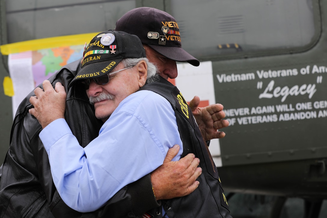 Two veterans embrace.