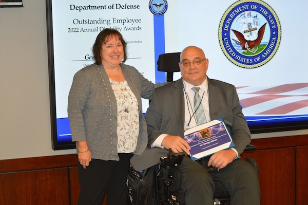 Mr. George Moore (right) Program Analyst for Strategic Systems Programs (SSP) received the Secretary of Defense 2022 Outstanding Civilian with a Disability Award Monday. He was nominated by colleague Martina Sibley (left) who said his accomplishments and commitment to SSP’s core values made him more than worthy of the honor. (Photo by Joseph Ross/Released)