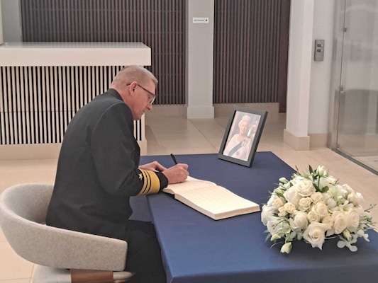 Vice Adm. Johnny Wolfe, Jr., Director, Strategic Systems Programs (SSP) signs the official condolence book for Her Late Majesty Queen Elizabeth II at the British Embassy. Wolfe’s visit underscored the importance of the special relationship between the United States and the  United Kingdom, which includes the Polaris Sales Agreement, an international agreement established between the U.S. and the UK in April 1963. The agreement provides for the sale to the UK of the Trident Strategic Weapon System. (British Embassy Photo/Released).