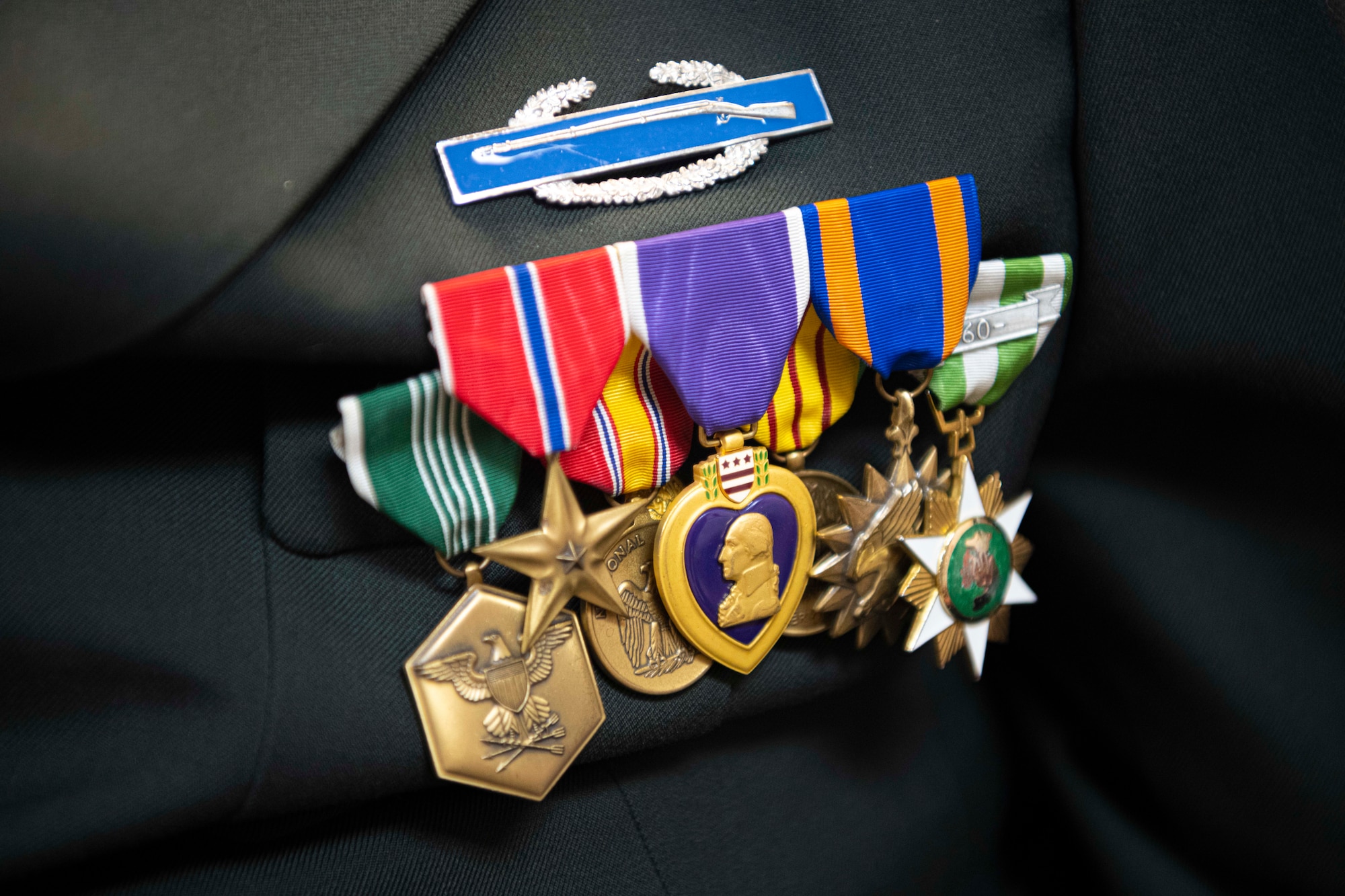 A Purple Heart medal lies in the center of a war veteran’s decorations May 15, 2023, in Haysville, Kansas.