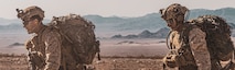 U.S. Marines with Echo Company, 2nd Battalion, 2nd Marine Regiment, 2nd Marine Division, run through a simulated mine field during Integrated Training Exercise (ITX) 3-23 at Marine Corps Air Ground Combat Center, Twentynine Palms, California, April 14, 2023. ITX is designed to provide large forces the opportunity to command and control their Marines through a live-fire program incorporating every element of the Marine Air-Ground Task Force. (U.S. Marine Corps photo by Sgt. Armando Elizalde)