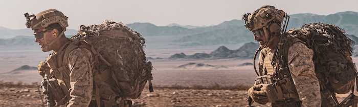 U.S. Marines with Echo Company, 2nd Battalion, 2nd Marine Regiment, 2nd Marine Division, run through a simulated mine field during Integrated Training Exercise (ITX) 3-23 at Marine Corps Air Ground Combat Center, Twentynine Palms, California, April 14, 2023. ITX is designed to provide large forces the opportunity to command and control their Marines through a live-fire program incorporating every element of the Marine Air-Ground Task Force. (U.S. Marine Corps photo by Sgt. Armando Elizalde)