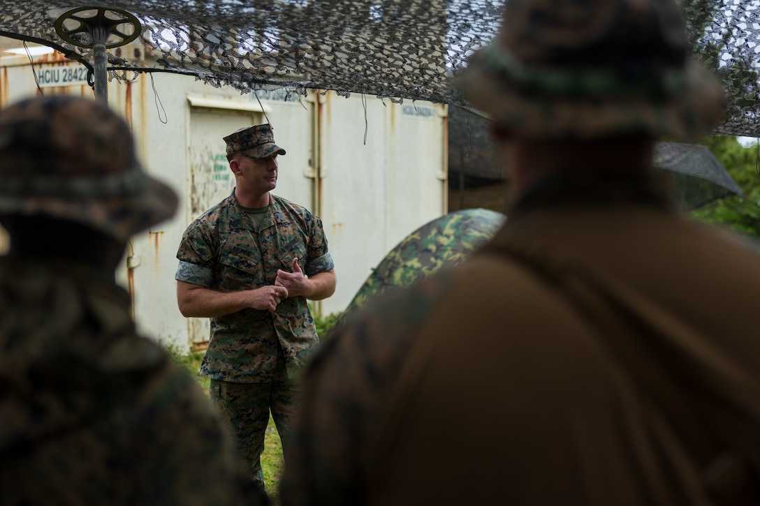 U.S. Marine Corps Master Sgt. Jason Krumrie, the 0311 monitor with Manpower Management Enlisted Assignments 22, speaks to Marines with 1st Battalion, 7th Marines about retention and reenlistment opportunities as part of the MMEA Roadshow in the Central Training Area on Okinawa, Japan, April 26, 2023. During the MMEA Roadshow, career monitors met with members of the Fleet Marine Force to discuss continuing their careers with the new initiatives available under Talent Management 2030. 1st Battalion, 7th Marines is forward-deployed in the Indo-Pacific with 4th Marine Regiment, 3d Marine Division as part of the Unit Deployment Program. Krumrie is a native of Manteno, Illinois.