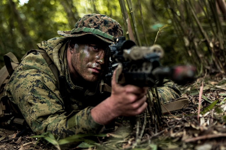 U.S. Marine Corps Lance Cpl. Thomas Smith, a rifleman with 1st Battalion, 7th Marines, posts security during a patrol exercise in the Central Training Area on Okinawa, Japan, April 26, 2023. The exercise was designed to sustain proficiency operating as small, distributed units in an austere environment. 1st Battalion, 7th Marines is forward-deployed in the Indo-Pacific with 4th Marine Regiment, 3d Marine Division as part of the Unit Deployment Program. Smith is a native of Pelham, Georgia.