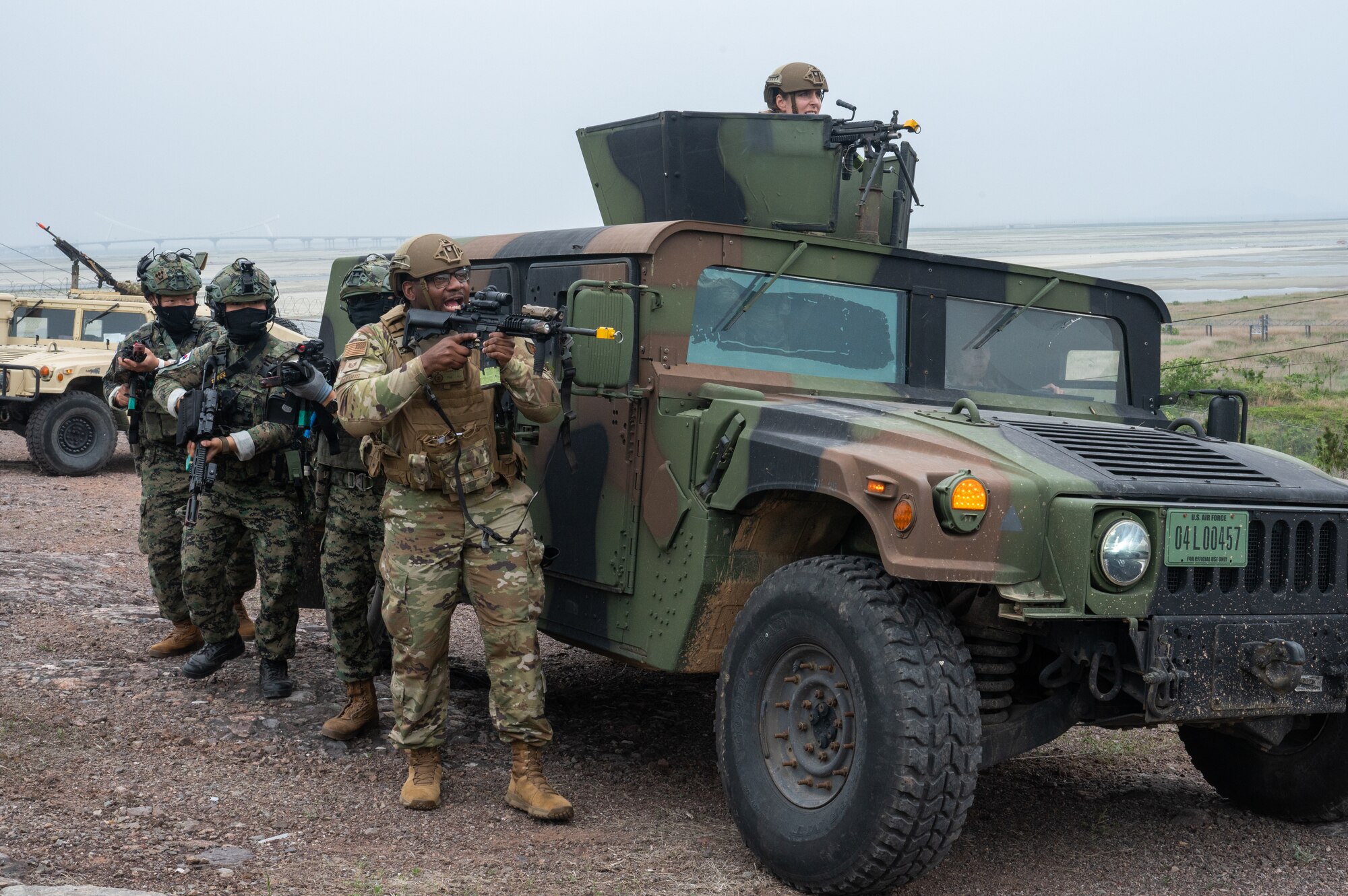 8th Security Forces Squadron Defender, shouts a command while leading a fireteam of Republic of Korea Army soldiers during a training event at Kunsan Air Base