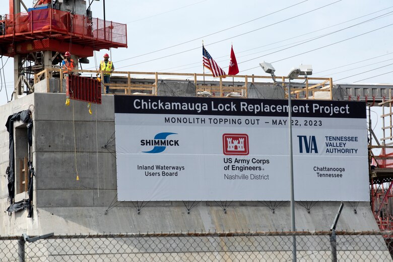 Shimmick Crane Operator Patrick Harrison lifted the last concrete form from monolith L13 to mark the official completion of the first of 36 monoliths. The U.S. Army Corps of Engineers Nashville District and its contractor, Shimmick, held a topping-off ceremony May 22, 2023, at the Chickamauga Lock Replacement Project on the Tennessee River in Chattanooga, Tennessee. (USACE Photo by Lee Roberts)