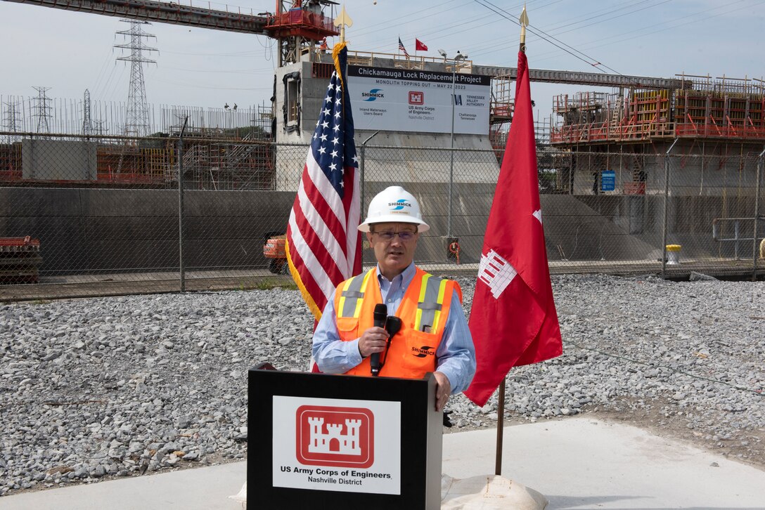 Shimmick Chief Executive Officer and President Steve Richards gives opening comments before giving the signal to remove the last concrete form during a topping-off ceremony marking the completion of the first of 36 monoliths of the lock chamber for the Chickamauga Lock Replacement Project on the Tennessee River in Chattanooga, Tennessee. (USACE Photo by Lee Roberts)