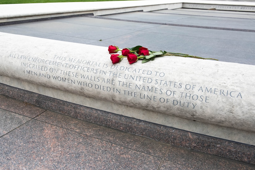 Red Roses lay above the engraved words at the entrance of the National Law Enforcement Officers Memorial in Washington D.C.