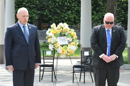 The Director of the Army Criminal Investigation Division, Gregory D. Ford and the Division Chief Warrant Officer, Chief Warrant Officer 5 Paul D. Arthur, place a wreath of remembrance at the National Law Enforcement Officers Memorial.