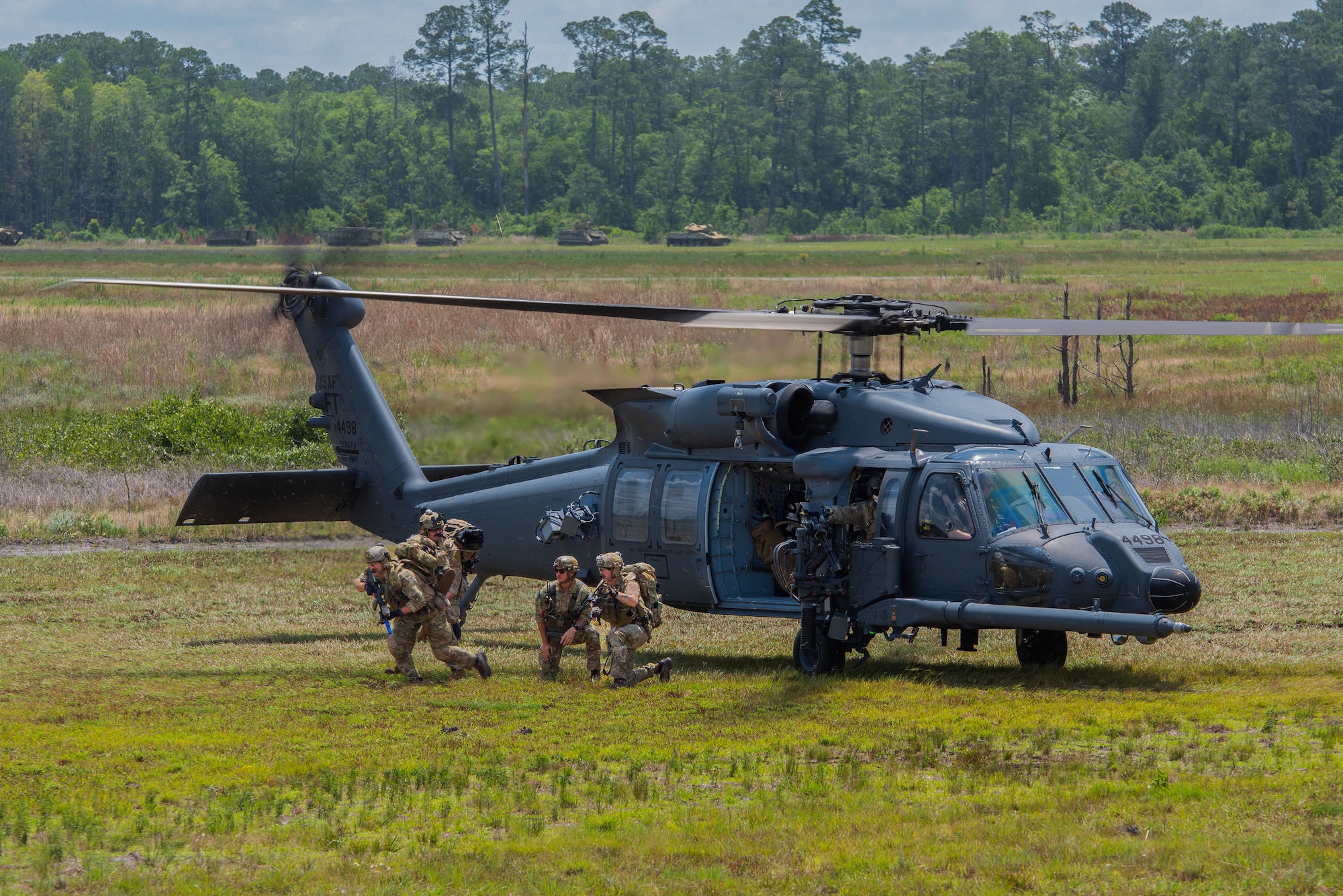 Airmen exiting helicopter
