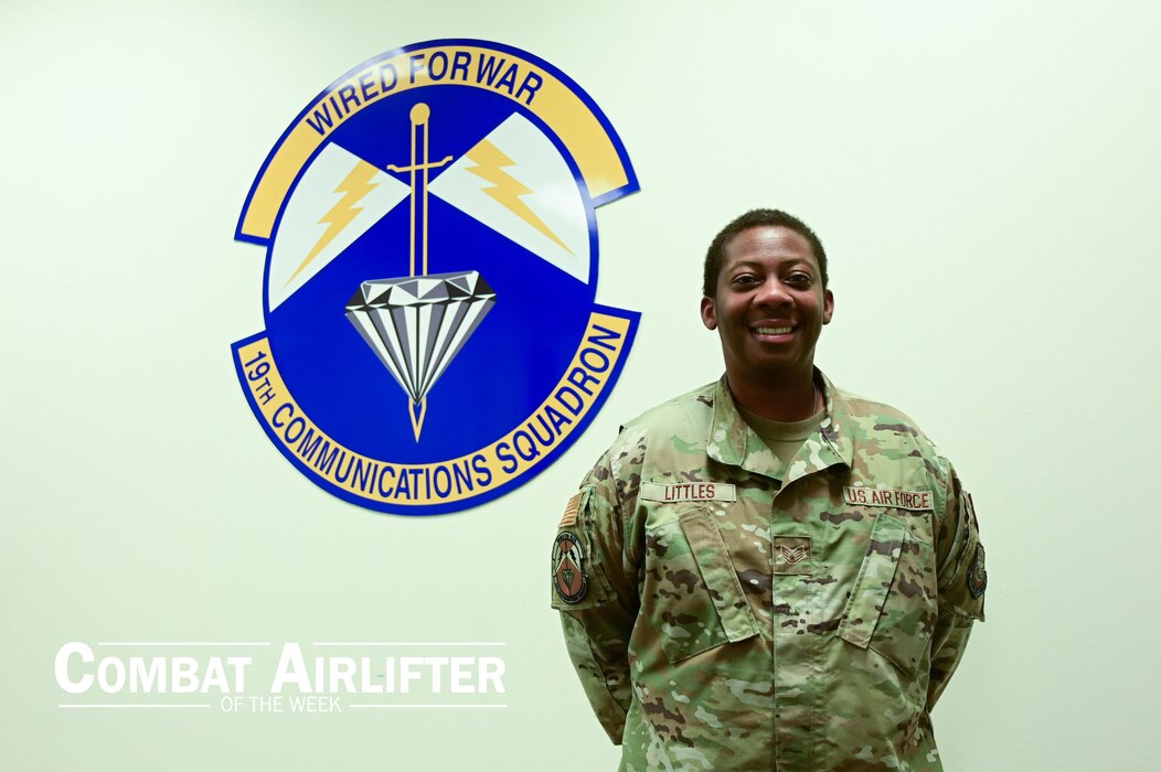A man in uniform poses for a photo