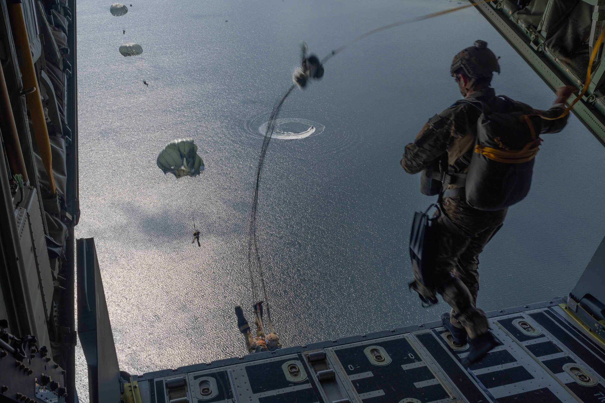 U.S. Air Force Special Tactics operators, assigned to the 21st Special Operations Wing, conduct static-line jump training at Hurlburt Field, Florida, April 26, 2023. Emerald Warrior is the largest joint special operations exercise involving U.S. Special Operations Command forces training to respond to various threats across the spectrum of conflict. (U.S. Air Force photo by Tech. Sgt. Jael Laborn)