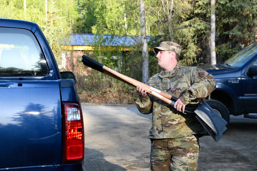 Senior Airman Sean Lake, 168th Wing, Alaska Air National Guard, loads shovels in preparation to help with debris clearing in Circle, Alaska, May 23, 2023. Four Guardsmen and one member of the Alaska State Defense Force will assist with cleanup and flood recovery efforts at the request of the Alaska State Emergency Operations Center. (Alaska Air National Guard photo by Senior Master Sgt. Julie Avey)