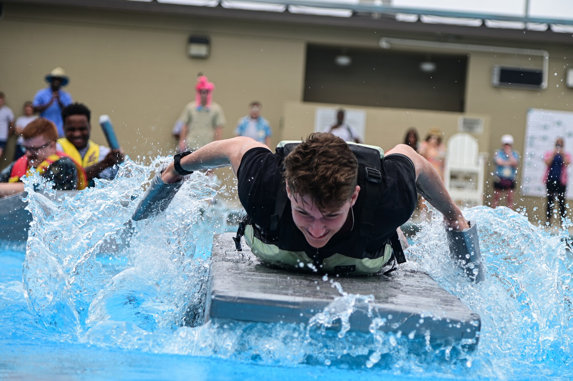 An Airman assigned to the 30th Civil Engineer Squadron Explosive Ordinance Disposal team races to the finish line during Space Launch Delta 30's bi-annual Hawkulture Day boat regatta. The Vandenberg SFB Hawk's COVE organized the days events, which promoted the culture of caring for fellow Airmen and Space Force Guardians. (U.S. Space Force photo by Airman 1st Class Ryan Quijas)
