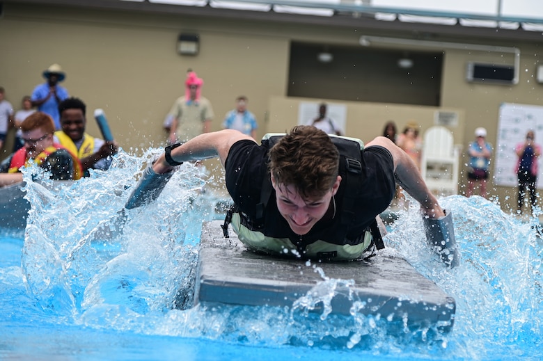 An Airman assigned to the 30th Civil Engineer Squadron Explosive Ordinance Disposal team races to the finish line during Space Launch Delta 30's bi-annual Hawkulture Day boat regatta. The Vandenberg SFB Hawk's COVE organized the days events, which promoted the culture of caring for fellow Airmen and Space Force Guardians. (U.S. Space Force photo by Airman 1st Class Ryan Quijas)