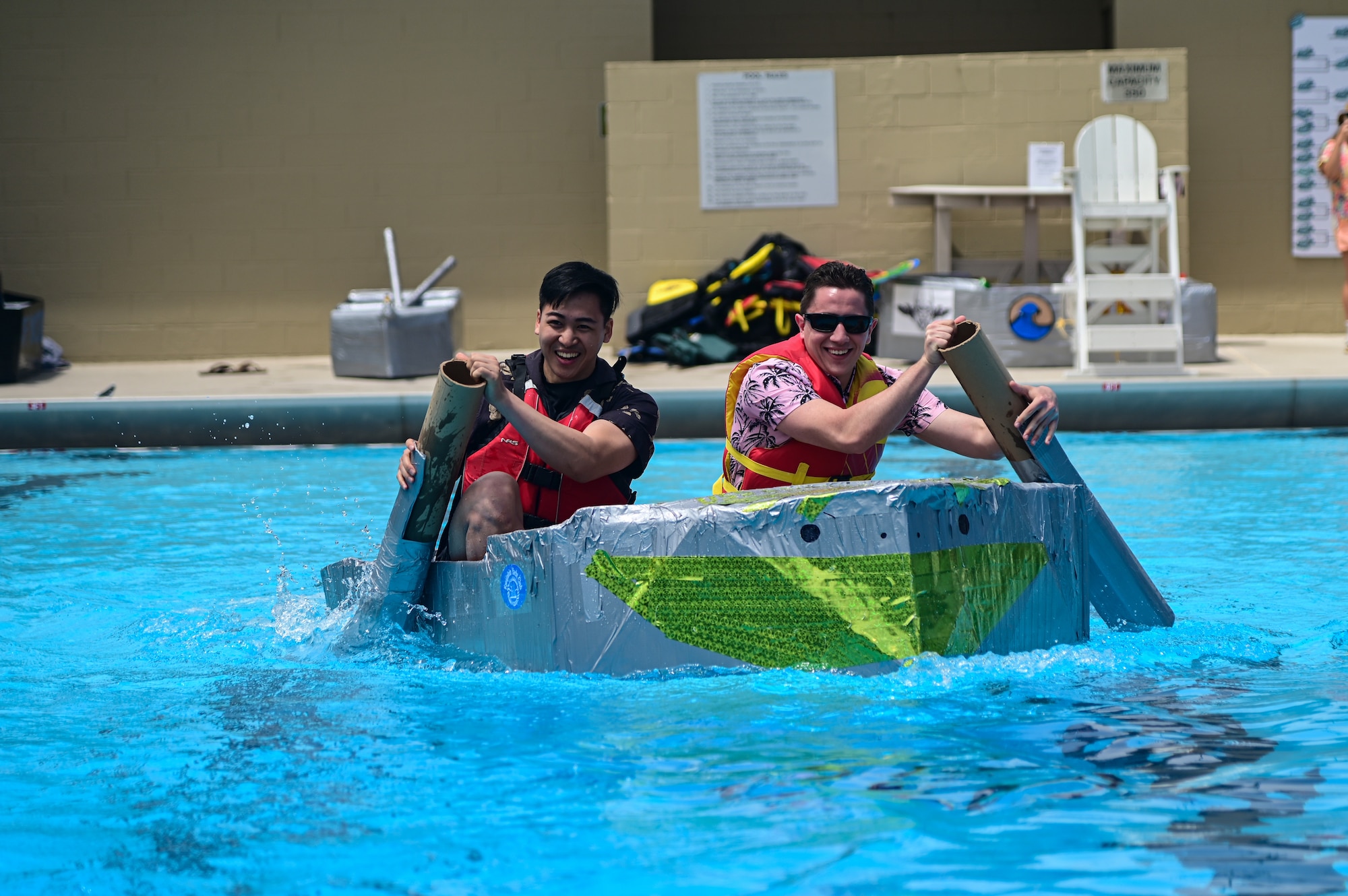 Guardians assigned to the 2nd Range Operations Squadron smile as they paddle to the finish line during the bi-annual boat regatta on Vandenberg Space Force Base, Calif., May 18, 2023. The boat regatta is the final event of Hawkulture Day, designed by the Vandenberg Hawk's COVE, which promoted the culture of caring for fellow Airmen and Space Force Guardians. (U.S. Space Force photo by Airman 1st Class Ryan Quijas)