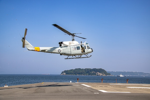 The 459th Airlift Squadron land a helicopter in response to a large-scale, multi-day, joint-partner exercise to promote interoperability and readiness at USNH Yokosuka