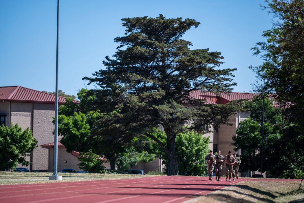 people run on a red track