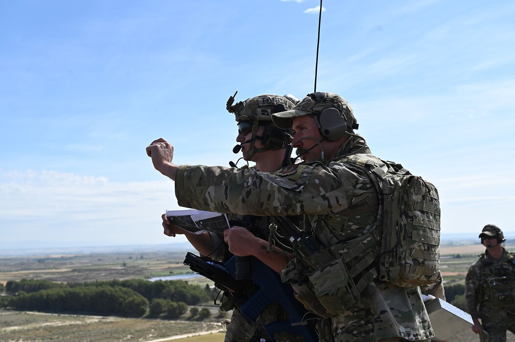 Airman guides another airman