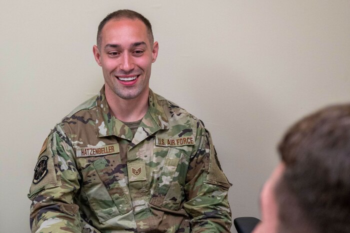 Staff Sgt. Raymond Hatzenbeller, a 934th Aeromedical Staging Squadron mental health technician, speaks to a patient at the 934 ASTS mental health office at the Minneapolis-St. Paul Air Reserve Station, Minnesota, May 6, 2023. The 934 ASTS mental health office was open for walk-ins during the May 2023 unit training assembly to answer a variety of questions regarding mental health, from depression to the resources on the installation that Airmen can turn to in times of need. (U.S. Air Force photo by Senior Airman Matthew Reisdorf)