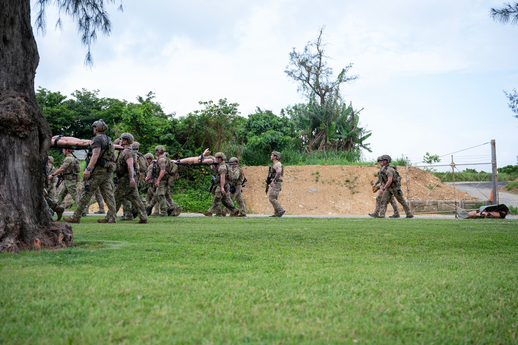 U.S. Air Force special tactics Airmen with the 320th Special Tactics Squadron transport simulated patients during Monster Mash, an operational readiness and resilience training, at Kadena Air Base, Japan, May 5, 2023. The event showcased the fitness and resiliency that special tactics Airmen must maintain to be ready to effectively support Special Operations Forces missions across the Pacific theater.  (U.S. Air Force photo by Staff Sgt. Jessi Roth)