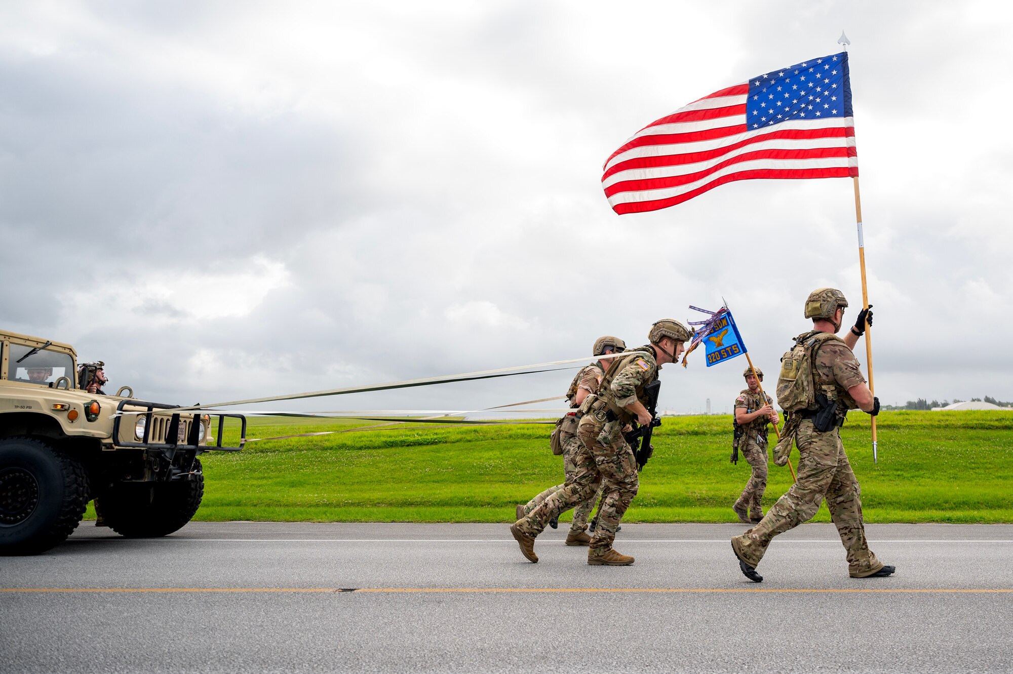 U.S. Air Force special tactics Airmen with the 320th Special Tactics Squadron pull a humvee during Monster Mash, an operational readiness and resilience training, at Kadena Air Base, Japan, May 5, 2023. The event showcased the fitness and resiliency that special tactics Airmen must maintain to be ready to effectively support Special Operations Forces missions across the Pacific theater.  (U.S. Air Force photo by Staff Sgt. Jessi Roth)