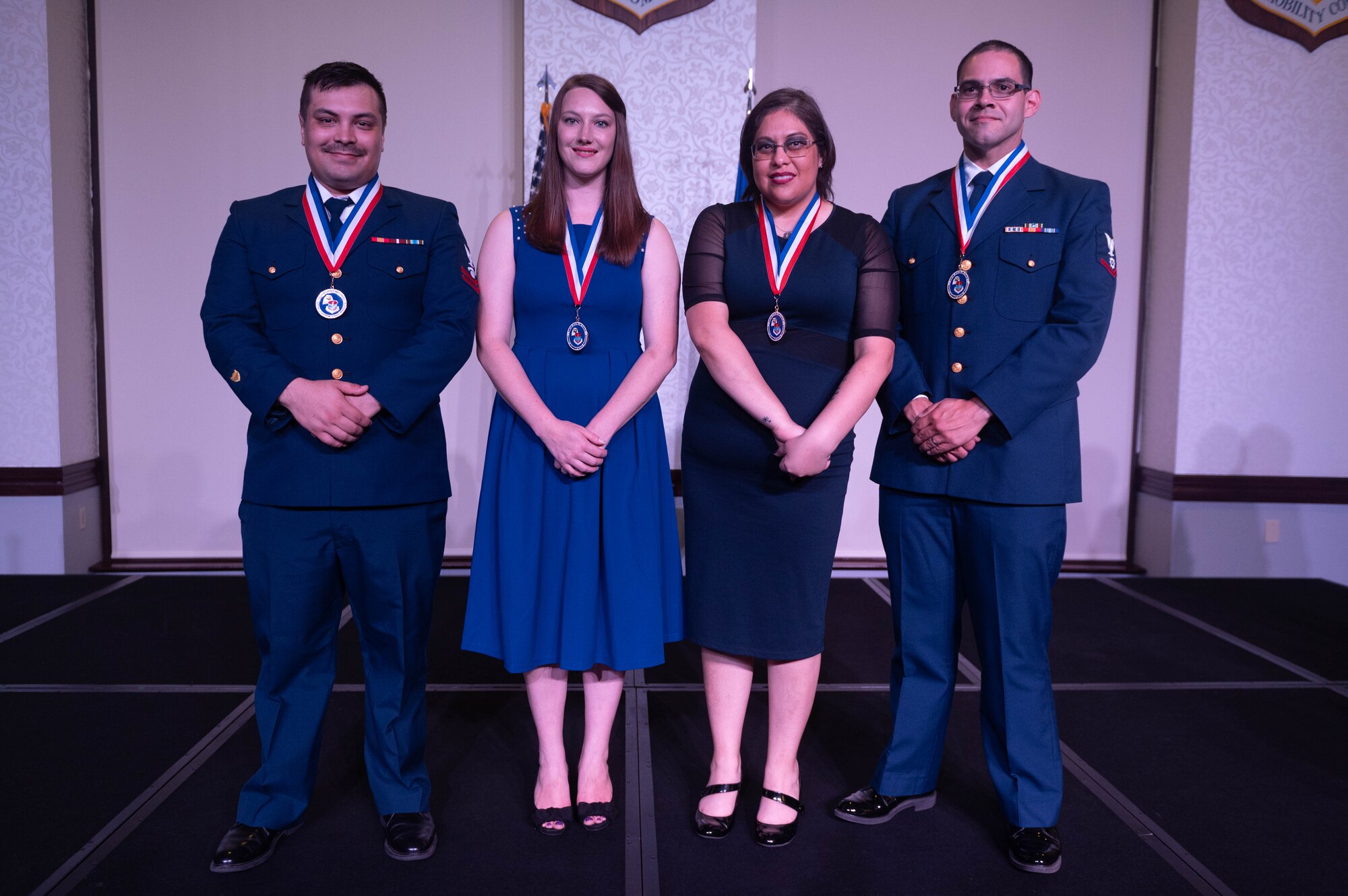 Two Coast Guardsmen and two civilians graduated Airman Leadership School at Scott Air Force Base, Illinois, May 18, 2023. Those attending ALS are prepared for positions of greater responsibility by strengthening their ability to lead, follow, and manage while also gaining a broader understanding of the military profession and their role within. (U.S. Air Force photo by Airman 1st Class Madeline Baisey)