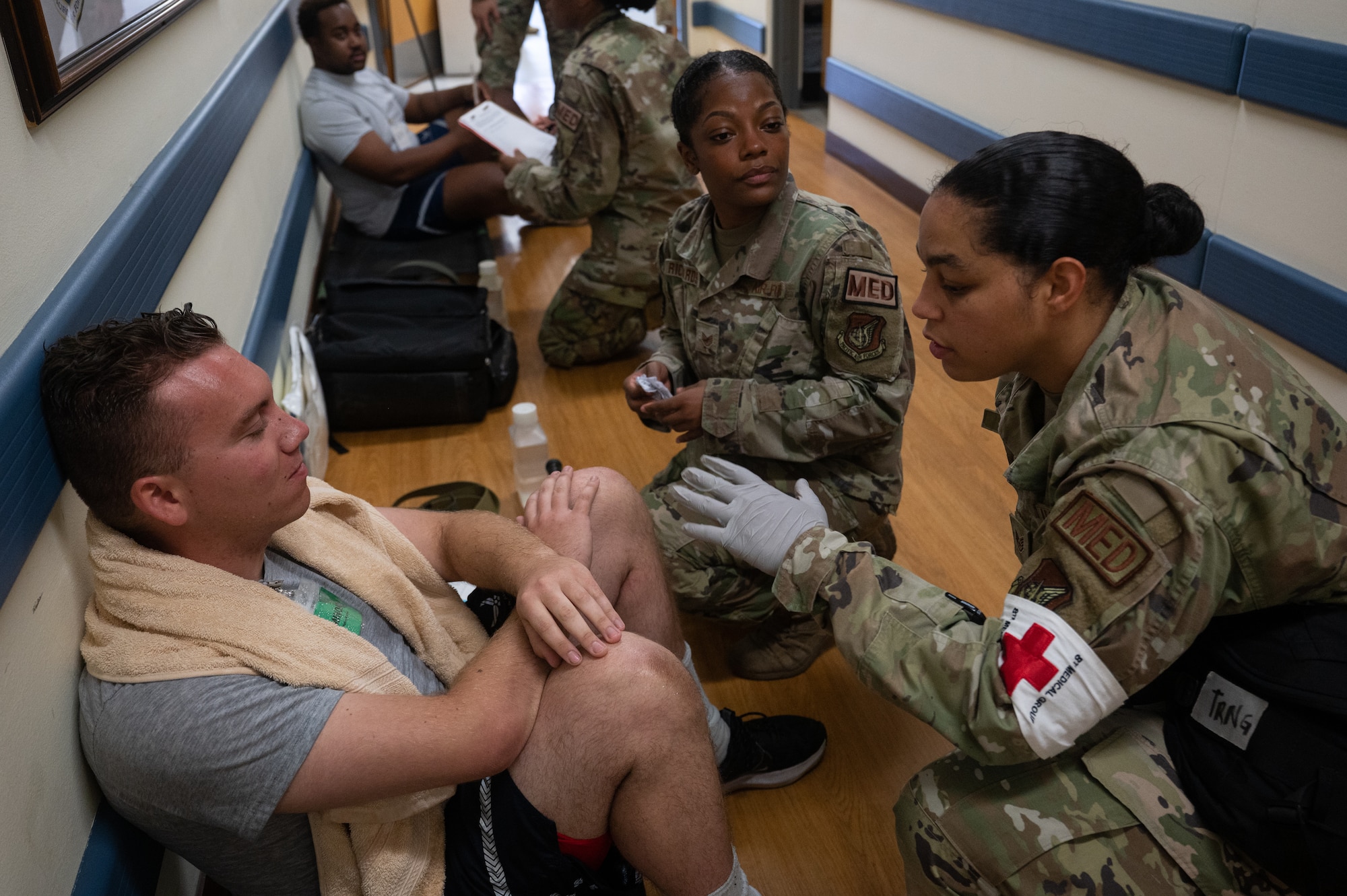 8th Operational Medical Readiness Squadron flight and operational medical technician and an 8 OMRS flight medic triage a simulated patient during a mass casualty training event