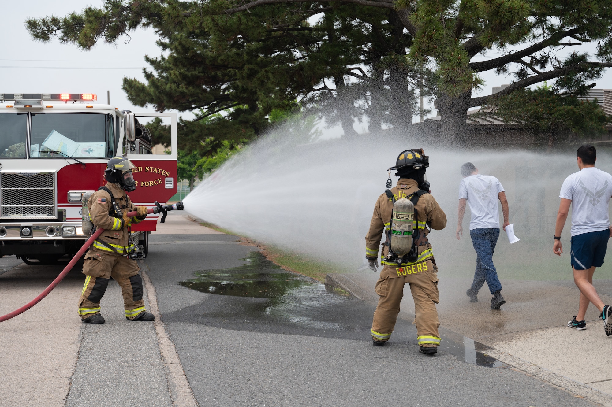 8th Civil Engineer Squadron firefighters, decontaminate simulated patients during a mass casualty training event at Kunsan Air Base