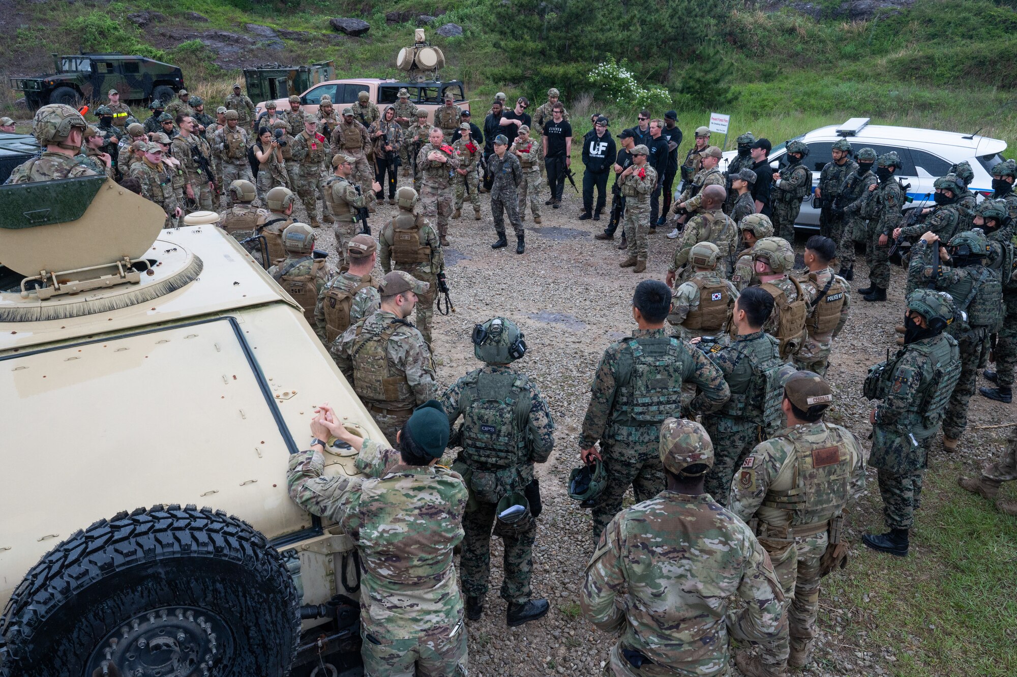 Republic of Korea Army soldiers and U.S. Air Force 8th Security Forces Squadron Defenders debrief a scenario during a training event at Kunsan Air Base