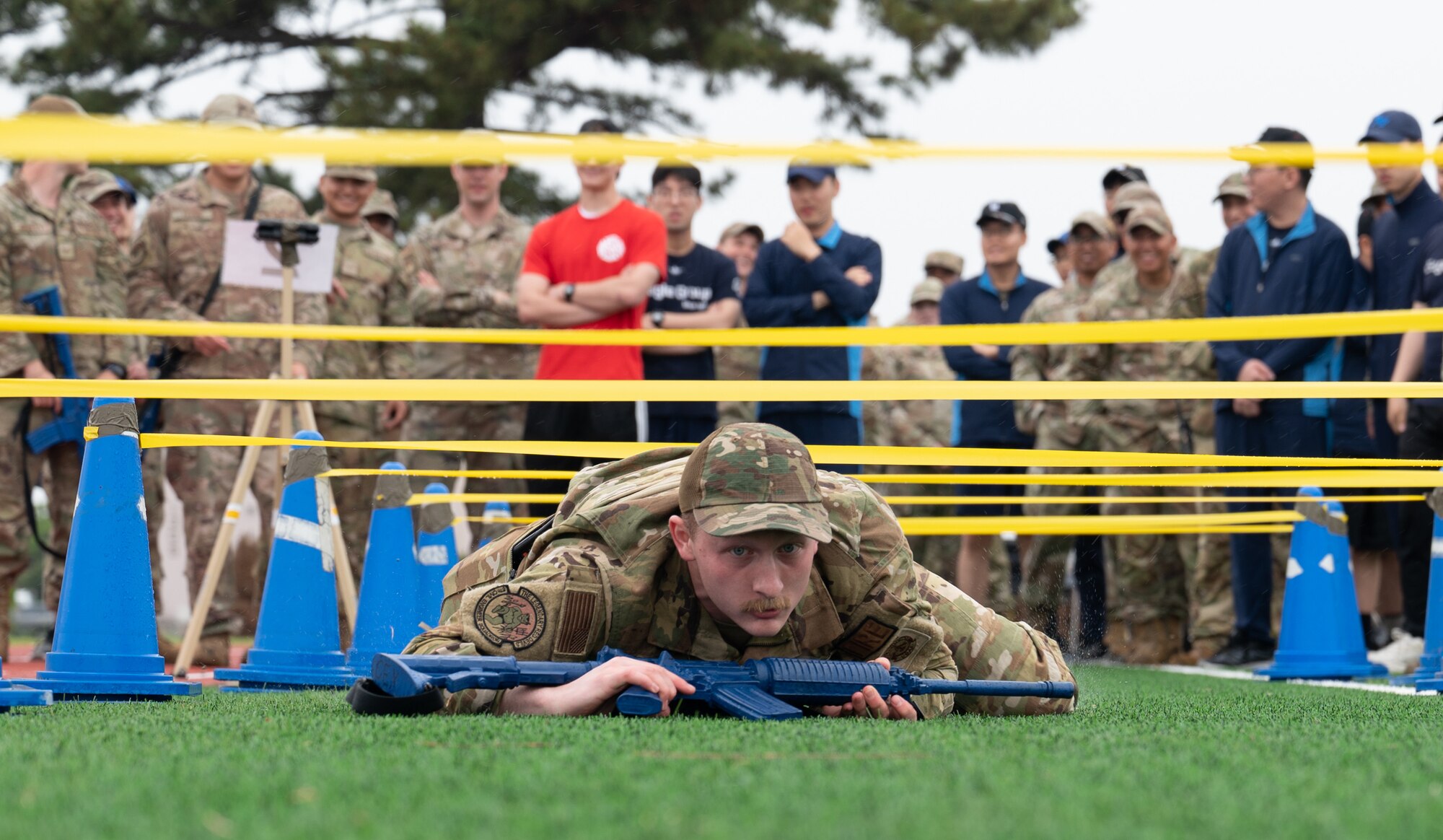 8th Civil Engineer Squadron firefighter, demonstrates how to low crawl during a training event at Kunsan Air Base