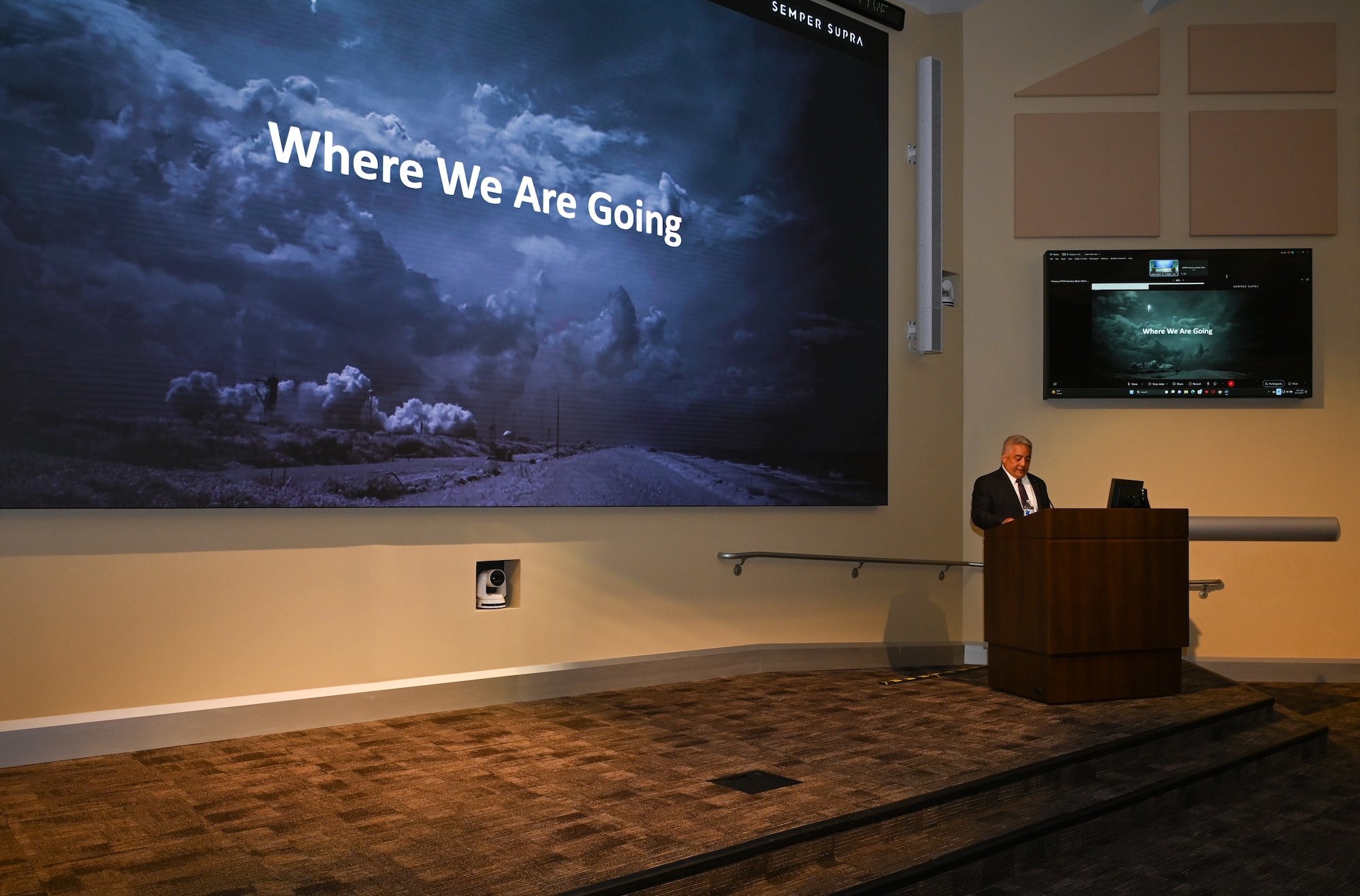 Man stands at podium