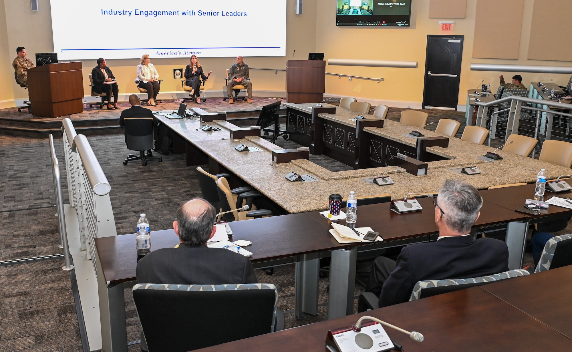 Group of people speak at conference