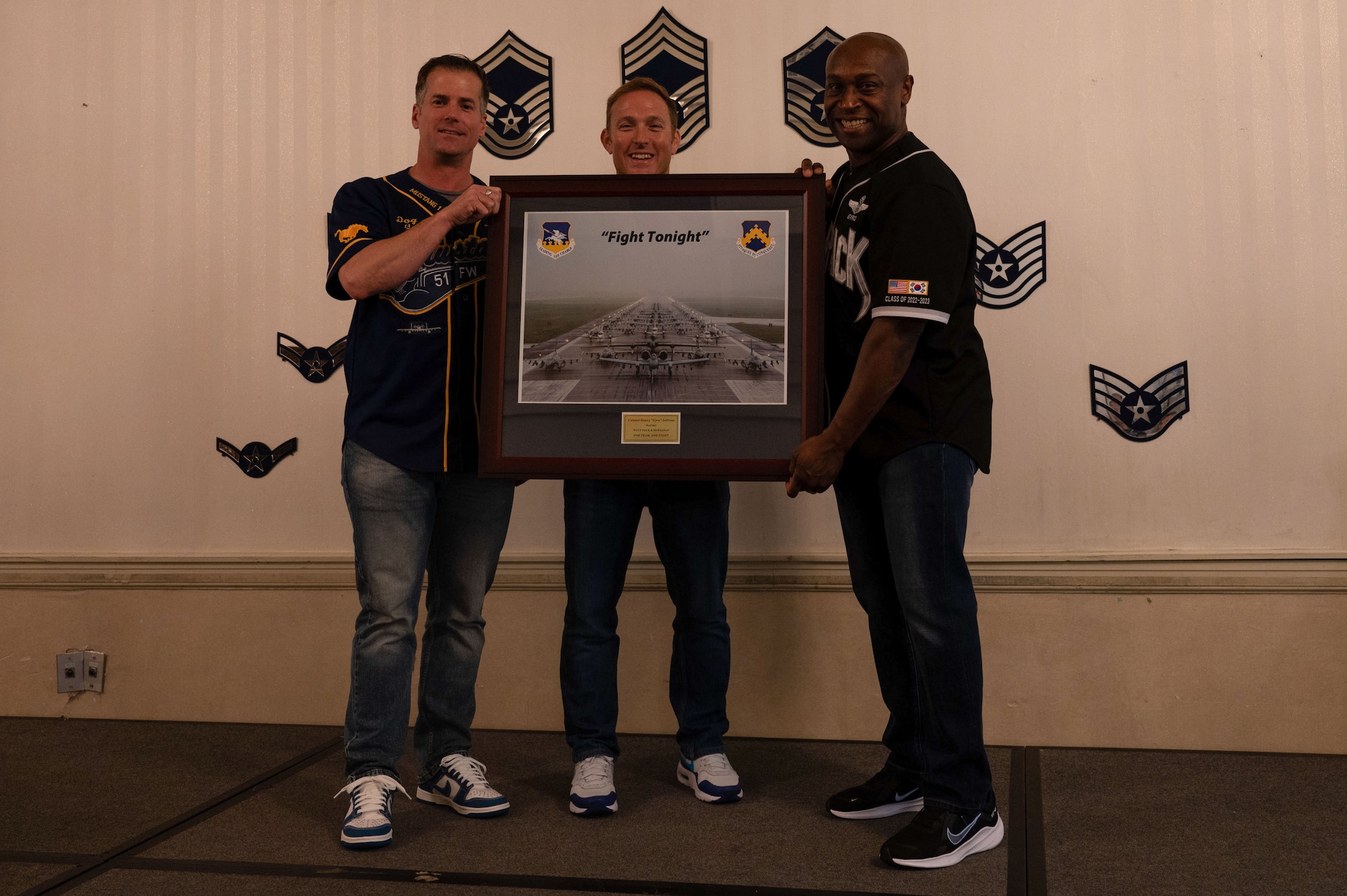 Col. Henry R. Jeffress, right, 8th Fighter Wing commander, poses with Col. Joshua Wood, 51 FW commander, left, and Col. Paul Davidson, 51 FW vice commander during a going away ceremony at Kunsan Air Base, Republic of Korea, May 23, 2023. Before serving as the 8 FW commander, Jeffress served as the 51 FW vice commander at Osan Air Base. (U.S. Air Force photo by Tech. Sgt. Timothy Dischinat)